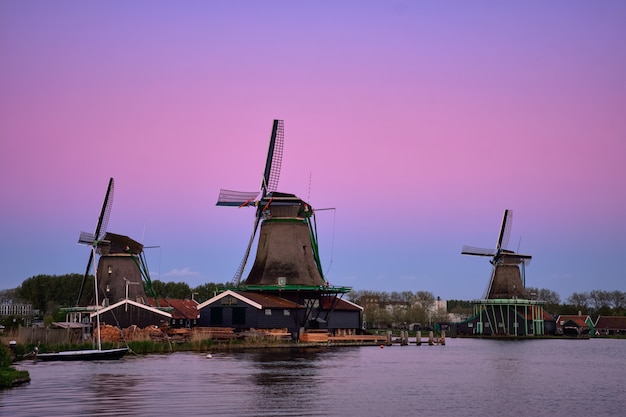 Windmills at Zaanse Schans in Holland in twilight after sunset.