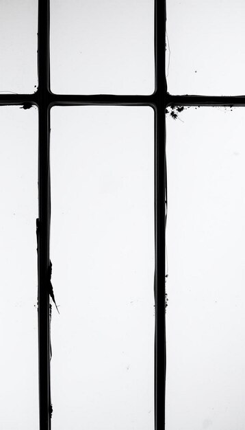 Photo a window with a black metal frame that has a number of the letter h on it