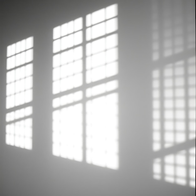 a window with the sun shining on it and the shadow of the windows on the wall