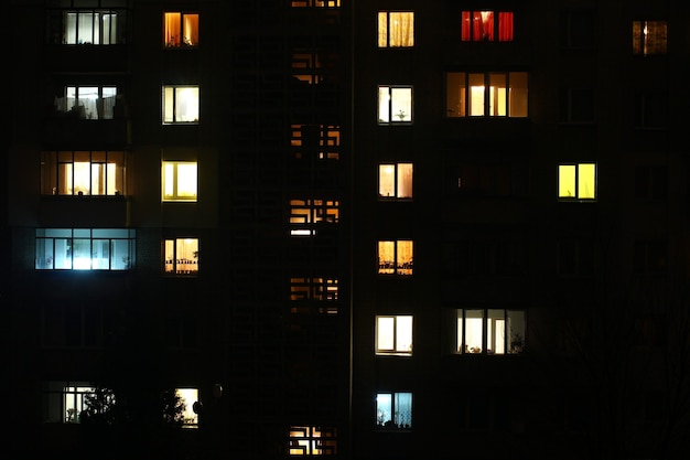 Windows at night. House building lights seamless background