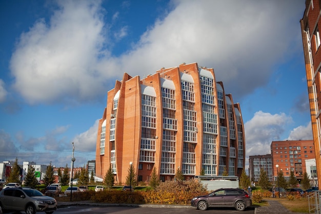 Windows of a residential multi-storey brick house. Modern buildings. The new multi-storey apartment