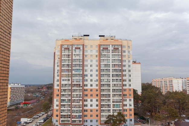 Windows of a residential multi-storey brick house. Modern buildings. The new multi-storey apartment