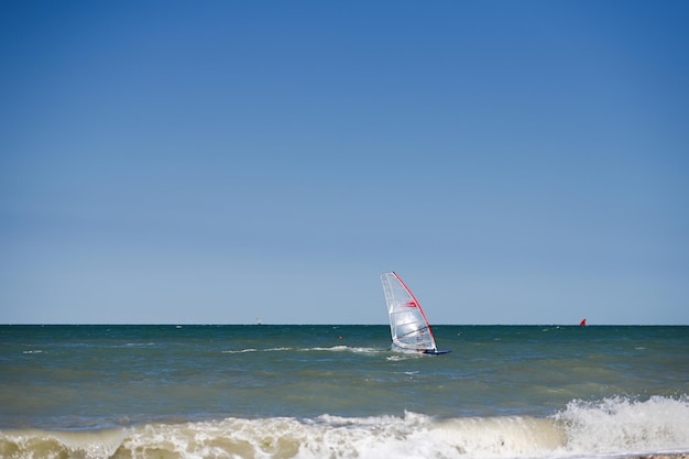 Windsurfer on a good riding waves at sea