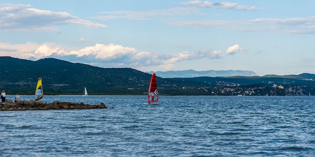 Windsurfers in the lagoon against the backdrop of a beautiful sky