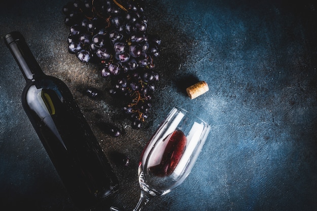 Wine bottle with glass and grapes