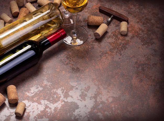 Wine bottles and glass on table