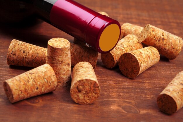 Wine bottles on wooden background, close up