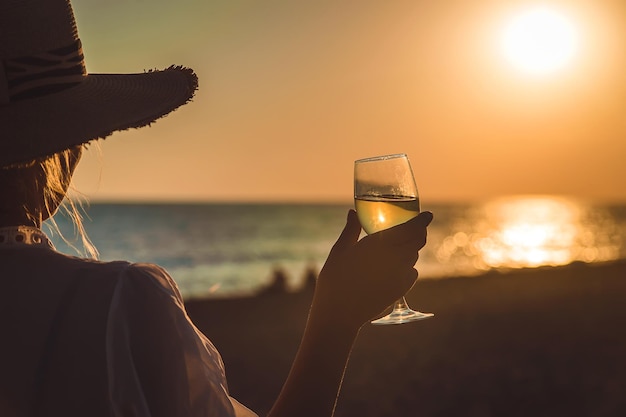 Wine glasses at sunset on the beach. Selective focus.