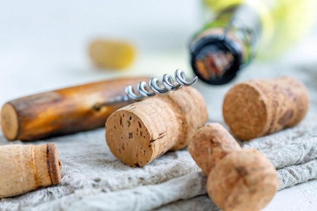 Wine stoppers old corkscrew and a bottle of wine