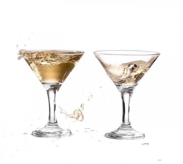 wine swirling in two goblet martini glass