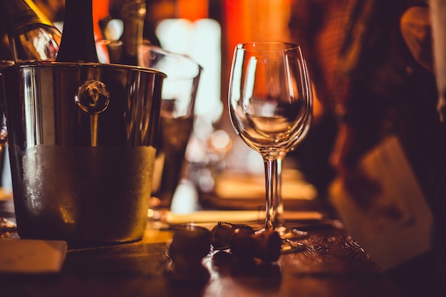 Wine tasting: an empty glass stands on the tasting table next to brochures