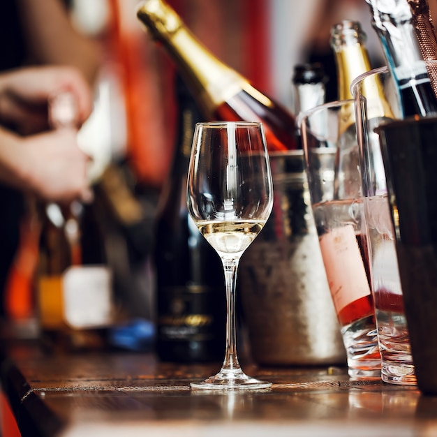 Wine tasting: a glass with the remains of wine is on the table 