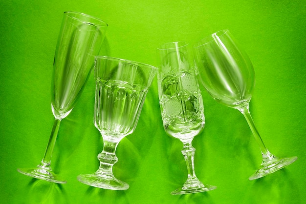 Wineglasses on green background