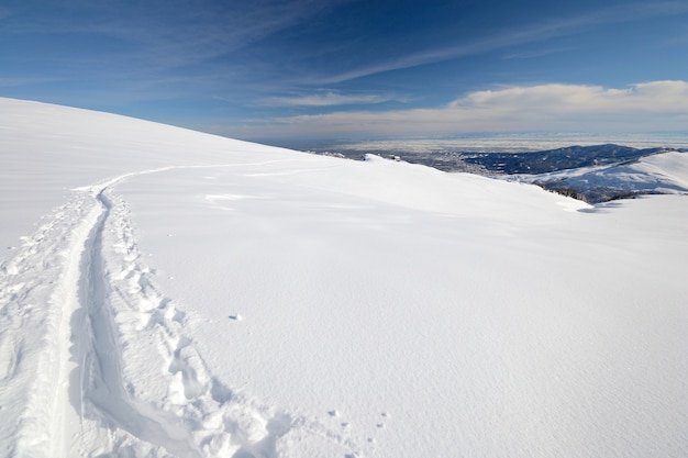 Winter adventures in the Alps ski track in the snow