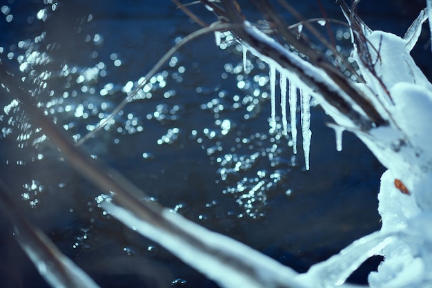 Winter background with icicles and empty space