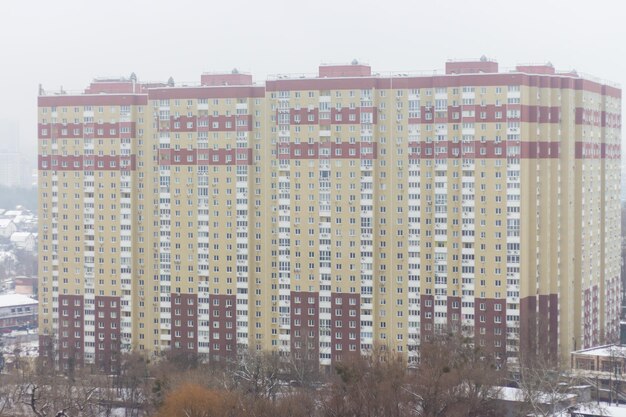 Winter city skyline. Urban scene. High modern building. Kyiv landmark. Winter cityscape.