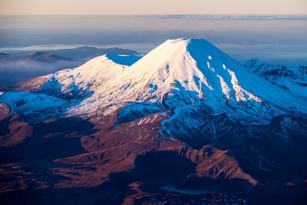 Winter evening light on Mounts Ngauruhoe and Tongariro. Lower Tama Lake in foreground. Tongariro National Park, New Zealand