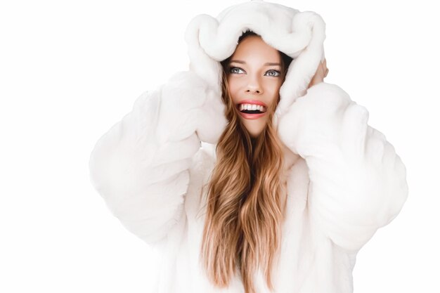 Winter fashion and beauty beautiful woman in white fur coat