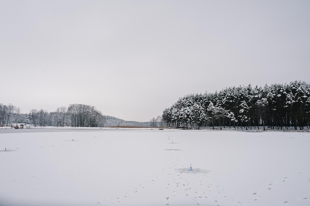 Winter fishing for pike on the imitation fish on the frozen lake Many small tackle for winter fishing on the ice pond