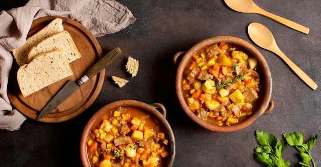 Winter food stew in bowl and slices of bread