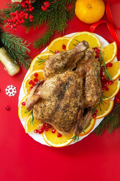 Winter Holiday table Christmas dinner Baked turkey on red background