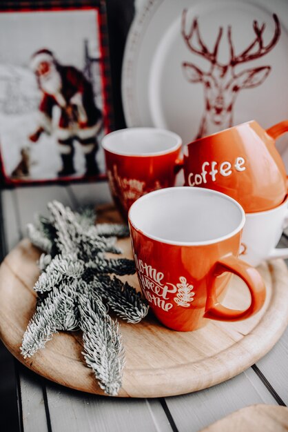 Winter hot drink. Christmas hot chocolate or cocoa with marshmallow on white wooden table with christmas decorations