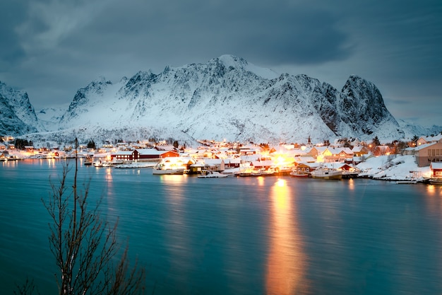 Winter houses on the ocean at night