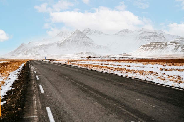 Winter Iceland landscape Traveling along the Golden Ring in Iceland by car Winter when the ground and the mountains are covered by snow Winter road