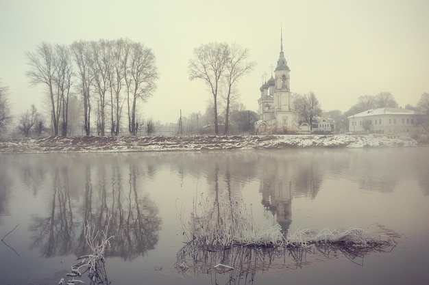 winter landscape church on the banks of the freezing river in vologda, christianity baptism russia christmas