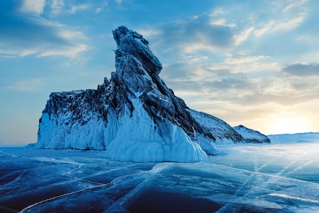 Winter landscape on Lake Baikal Sunrise against the backdrop of a huge rock