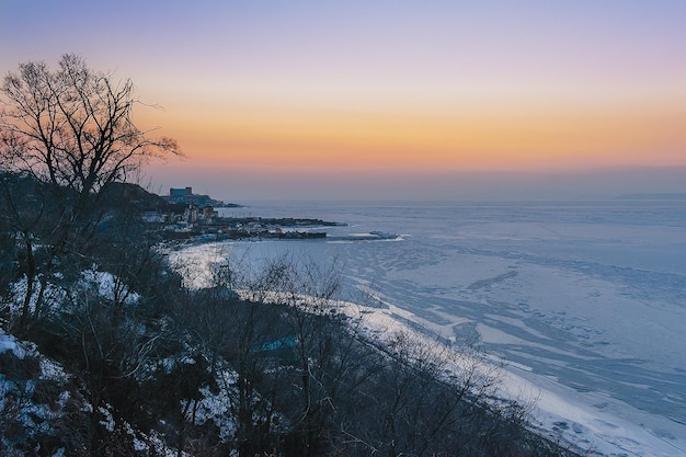 Winter landscape Sunset over the frozen sea