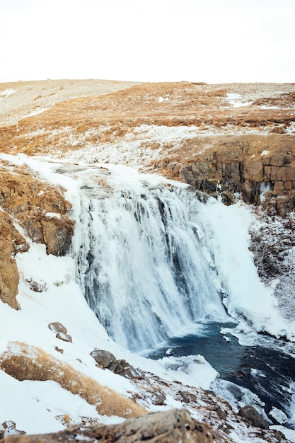 Winter landscape over a waterfall in Iceland, not far from LangjÃ¶kull glacier in Iceland