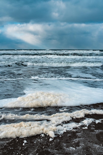 Winter landscape with frozen sea and icy beach Dramatic seascape Storm and snow weather