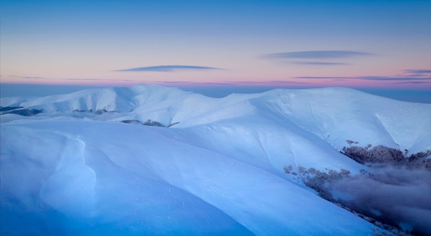 Winter mountain landscape. View of the dawn sky from Mount Gimba.