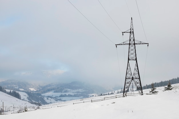 Winter mountain landscape with high-voltage current line