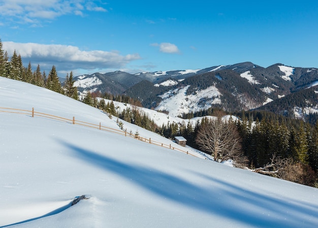 Winter mountain rural snow covered hill slope