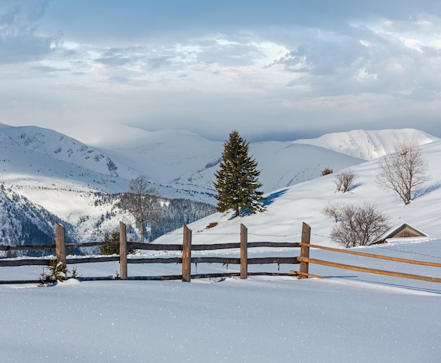 Winter mountain rural snow covered hill slope