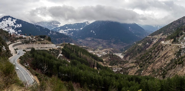 Winter in the mountains Epirus region Greece and country road on a winter day