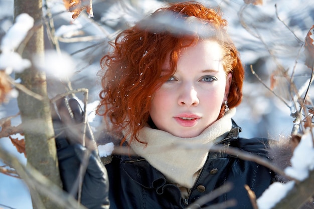 winter portrait of a beautiful woman freezing