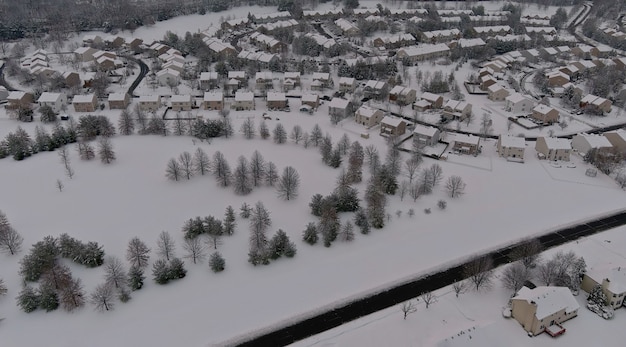 Winter scenery roof houses snowy residential small town during a winter day after snowfall of aerial view