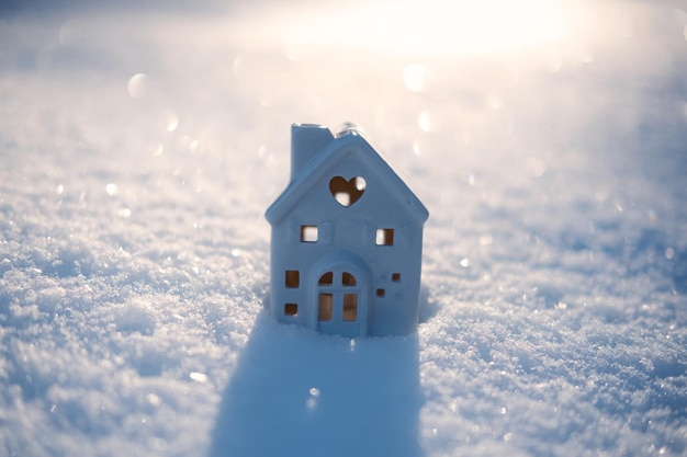 Winter solstice in snowy forest or park natural scene hibernal solstice toy house and sparkling snow