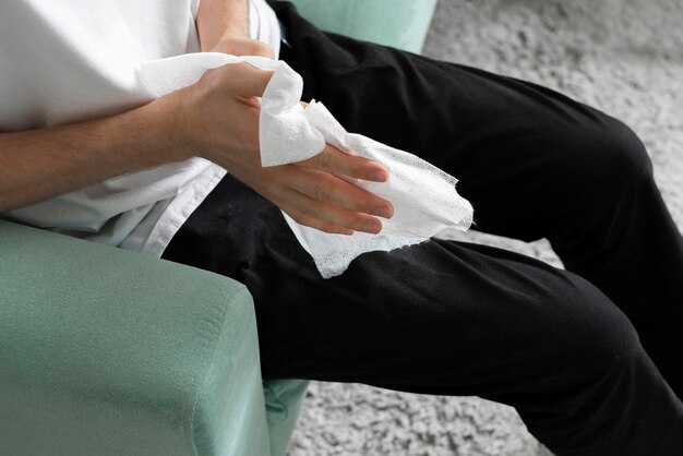 Wiping hands with a wet wipe personal hygiene concept