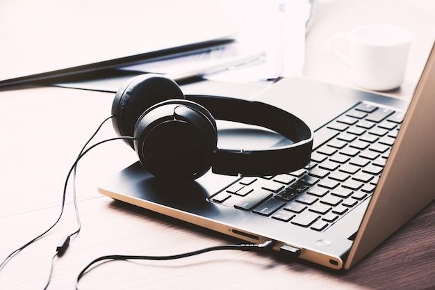 Wired black headphone isolated on the desktop