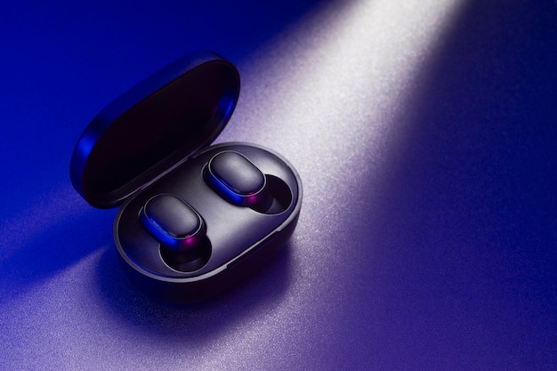 Wireless earbuds with neon cyberpunk style lighting