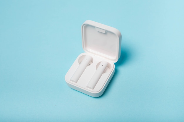 Wireless white headphones on white