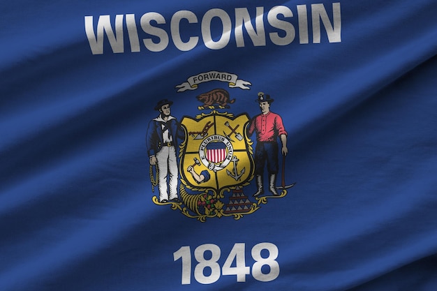 Wisconsin us state flag with big folds waving close up under the studio light indoors the official s