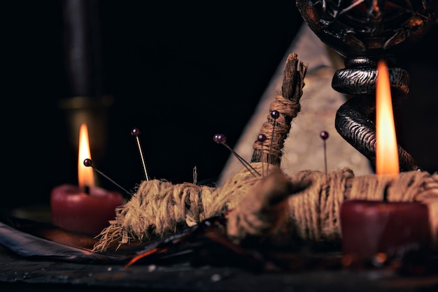 Witchcraft composition with burning candles jewelry and pentagram symbol Halloween