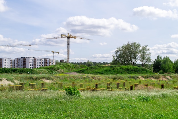 With crane building the house. Industrial view.