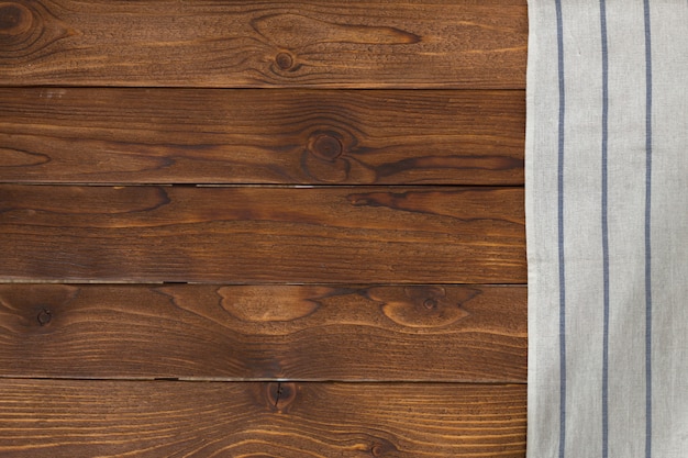 with empty wooden table with tablecloth