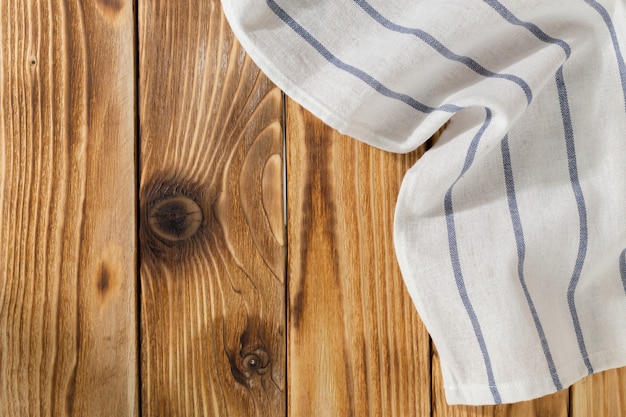 with empty wooden table with tablecloth